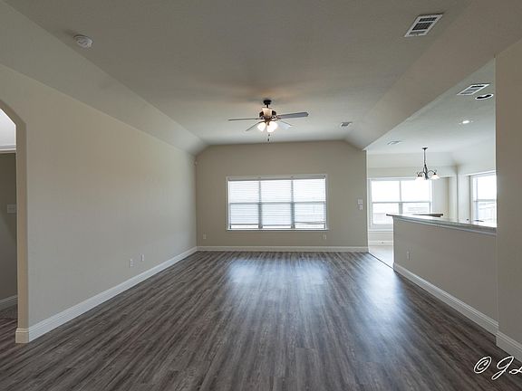 New vinyl plank flooring in Living, dining, and hallway
