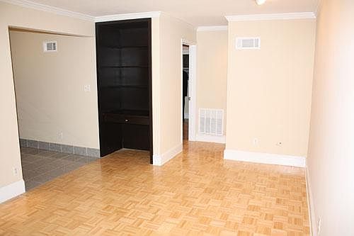 Large, open living room with built-in desk maximizes spaces 