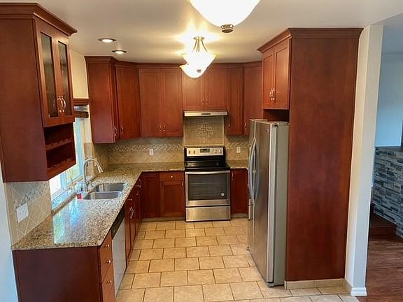 Microwave, dishwasher, refrigerator w/ice maker, two lazy susans and built-in wine rack