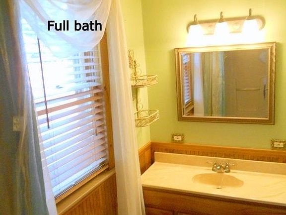 Downstairs bath, tub and shower, privacy window, large basin