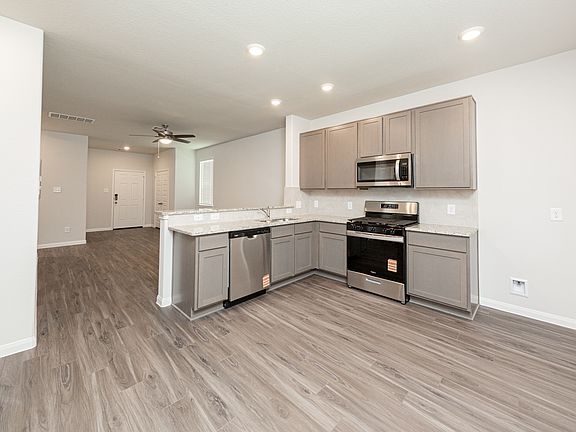 Kitchen and Dining Area to Family Room