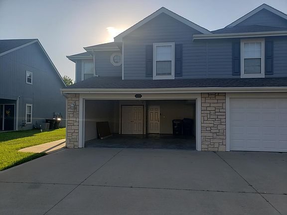 Front of house - garage open