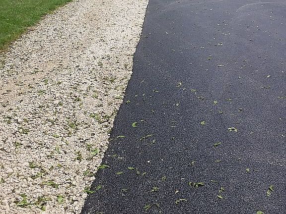 newer asphalt drive resealed