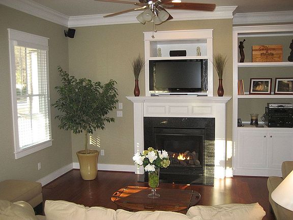 Living Room with gas fireplace and built in shelves