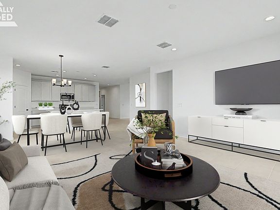 Staged great room of move-in ready single-story Clover by DRB Homes at Sienna Park, 1315 S. 215th Dr