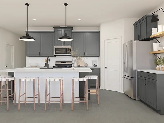 Kitchen with pendant lighting and floating shelves