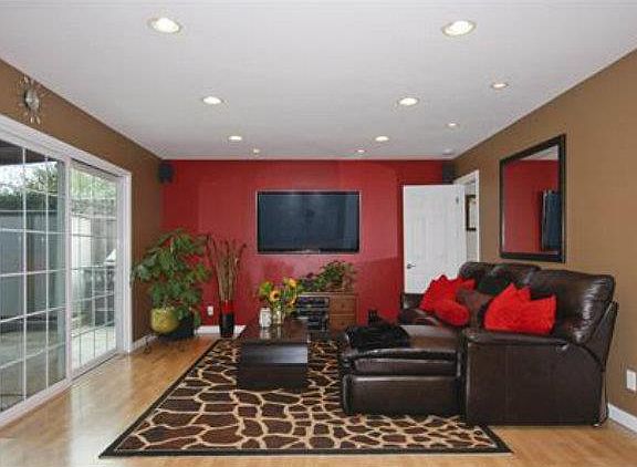 Family Room with brand new laminated flooring and sliding gl