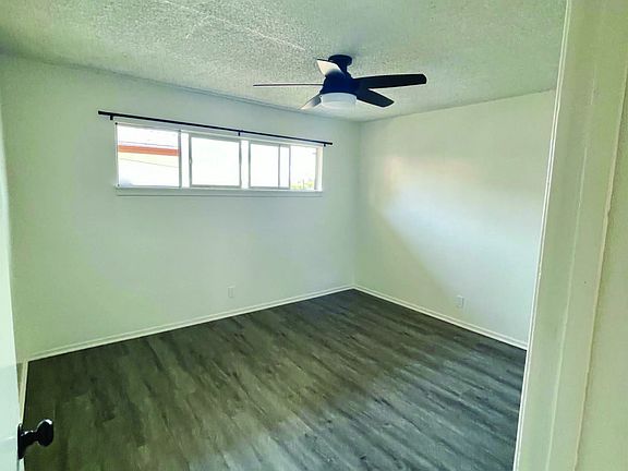 Large bedroom with new ceiling fan, paint and new hardwood floor laminate for easy cleaning. Large Closet space.