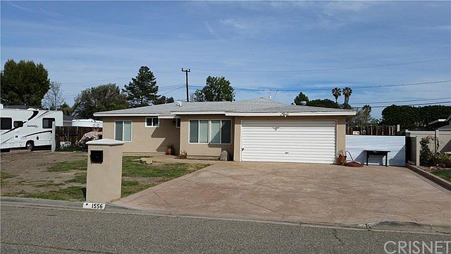 4 bedroom 2 bath large yard and extra wide 3 car s