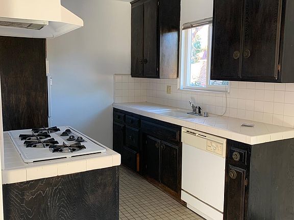 Kitchen with dishwasher and dining room