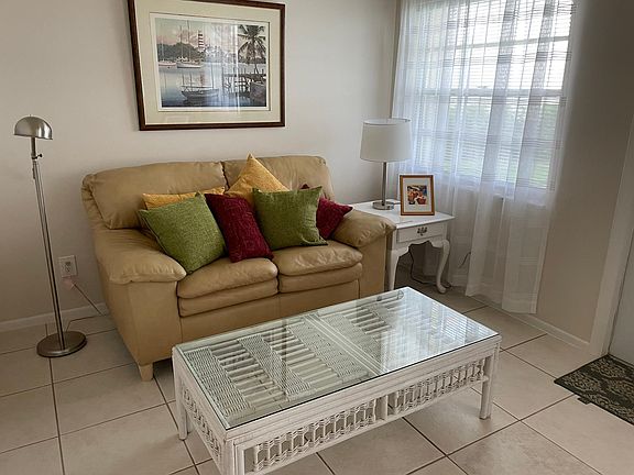 Comfortable Livingroom seating. All walls in this unit have been newly painted. The floors in the Livingroom are tile.