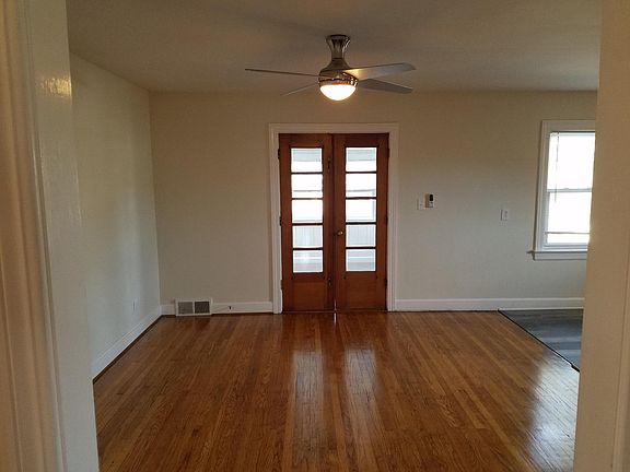 Large Dining Area opens up to both the kitchen and the Sun Room. Refinished hardwood floors.