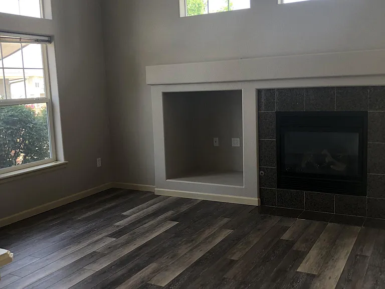 Great Room really is GREAT with these beautiful new floors and big windows.