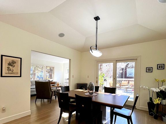 Dining room features sliding doors to beautiful, spacious deck with teak furniture