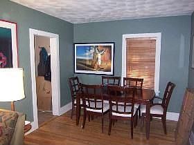 Dining area with custom wood blinds.