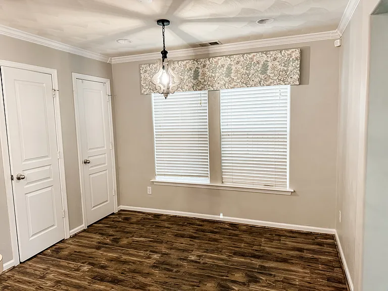 Eat-in kitchen with double pantries.