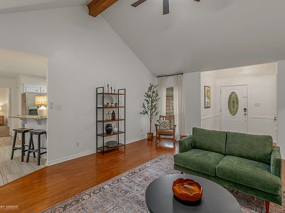Living room with natural light and vaulted ceilings