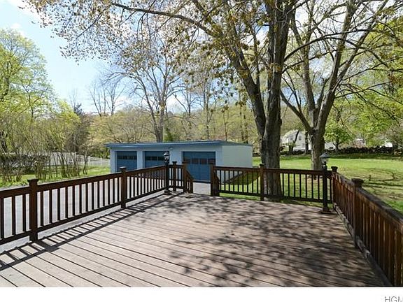 Deck with Railing with view of 3 car garage