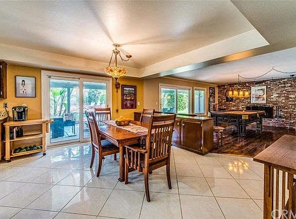 Large kitchen nook with glass sliders to backyard