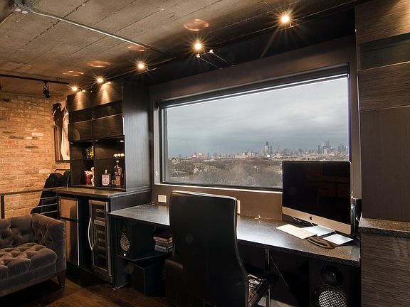 Upper office/den/music room with panoramic city skyline view. Fridge & wine cooler. Built in desk/cabinets. Rent includes high speed internet.