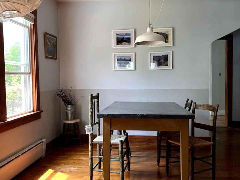 Hardwood floors throughout. Picturing the dining area in the main room