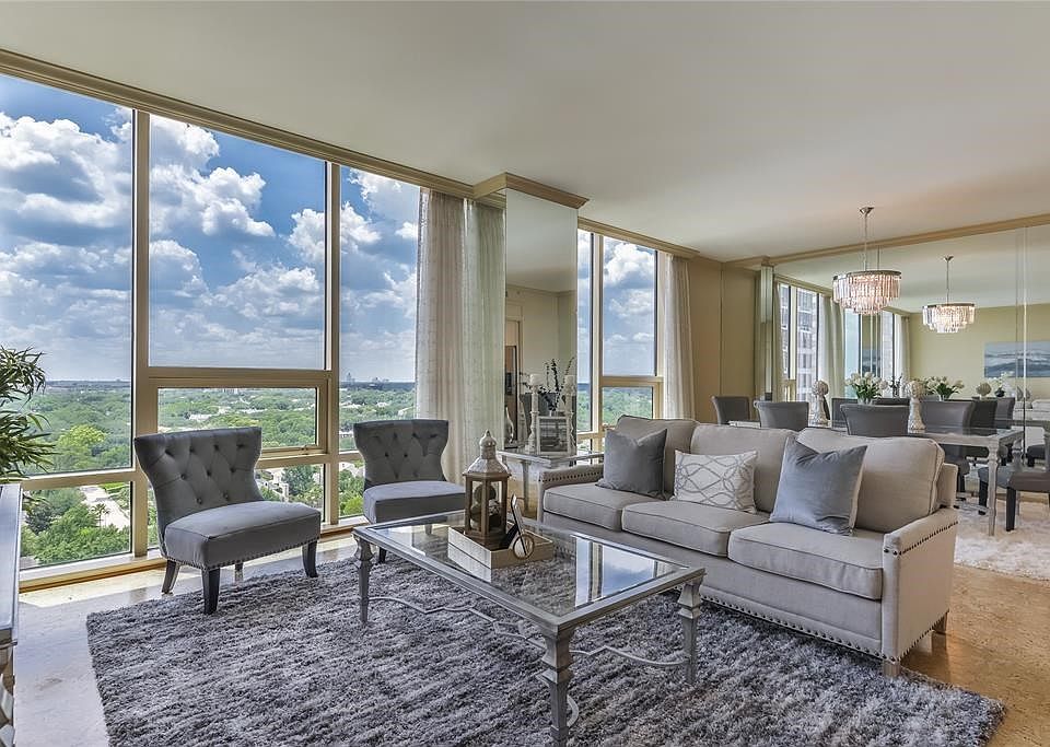Beautiful living and dining room with wall of floor to ceili