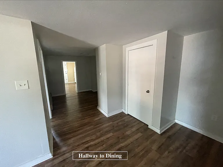 hallway to bedroom and dining