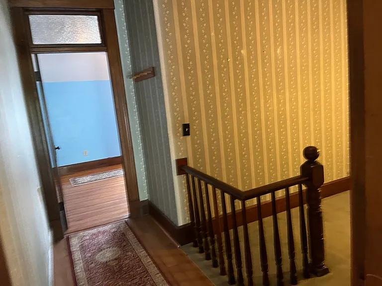 Entry into bedroom area. Use as study or storage.
