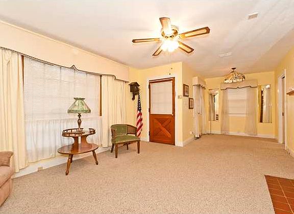 Living Room with fireplace and beautiful wood Mantle.