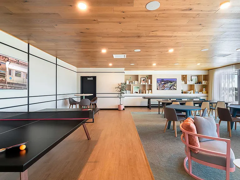 Whether it's game night or a casual hangout, Eleven33's entertainment lounge offers stylish comfort, natural light, and plenty of room to unwind.