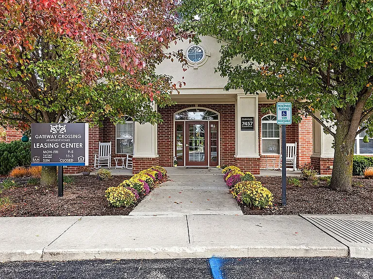 Welcome to Gateway Crossing _ our leasing center is framed by mature trees and colorful blooms that make a great first (and lasting) impression.