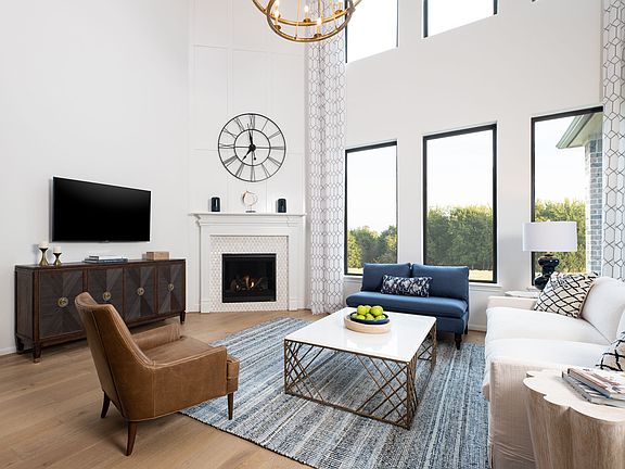 Gather your family and guests together in your lovely living room. Featuring soaring high ceilings,