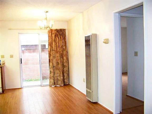 Dining Area in kitchen with sliding door exit to side yard