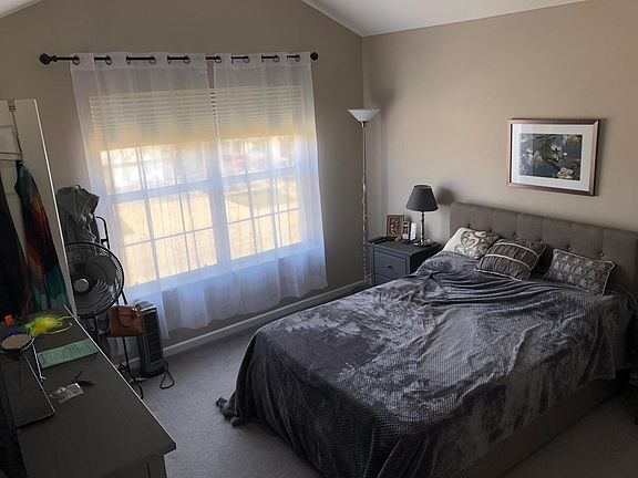 2nd bedroom with cathedral ceilings and walk-in closet