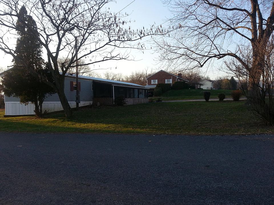 SW w/addition, covered porch, large driveway.