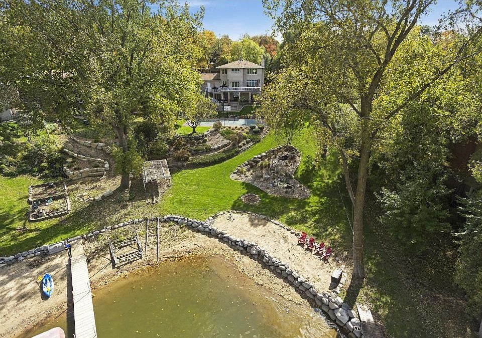 Enjoy the sandy beach! This home is perfect for entertaining and having lakeside bonfires.