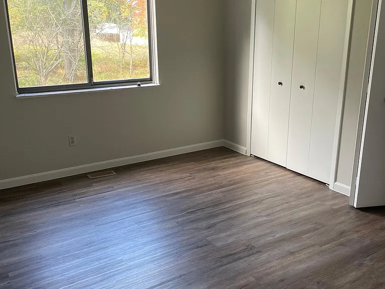 1st Bedroom New LVP flooring.