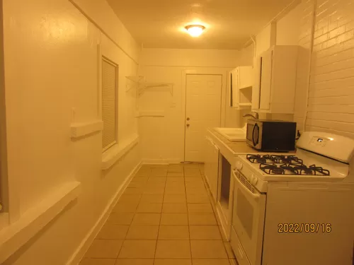 KITCHEN WITH BACK DOOR TO THE LAUNDRY. - 310 Hawthorne St #1