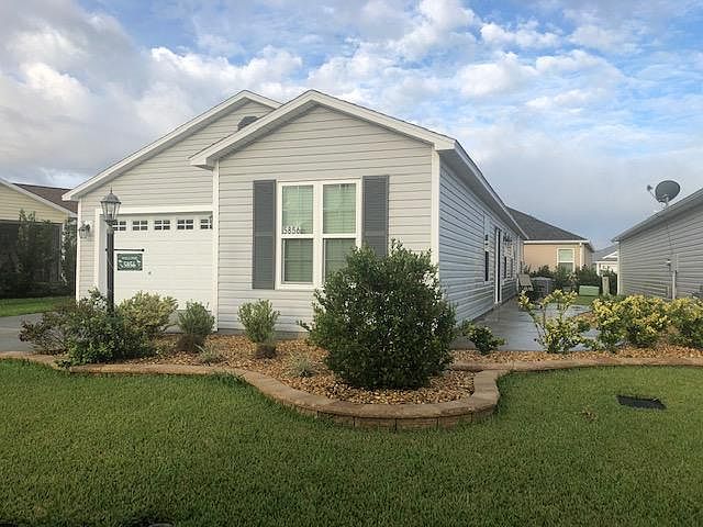 House view with landscaping.