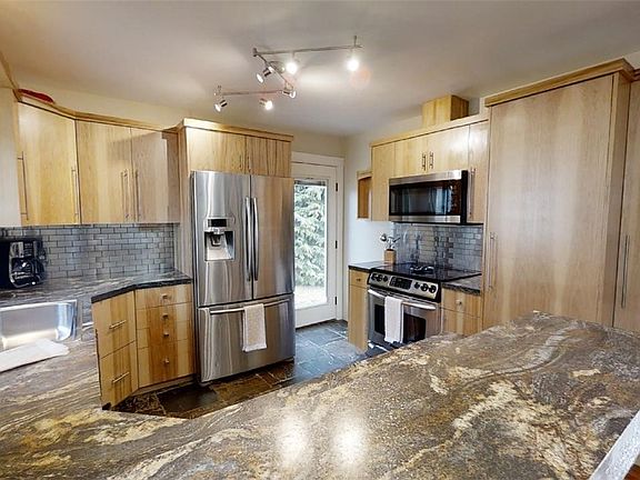 Recently updated kitchen! Custom hickory cabinets, slate flooring. Stainless steel appliances stay!