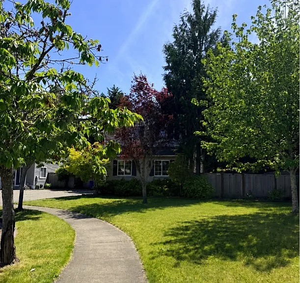 Sidewalk in front of the house. Large front yard giving you lots of space to spread out.