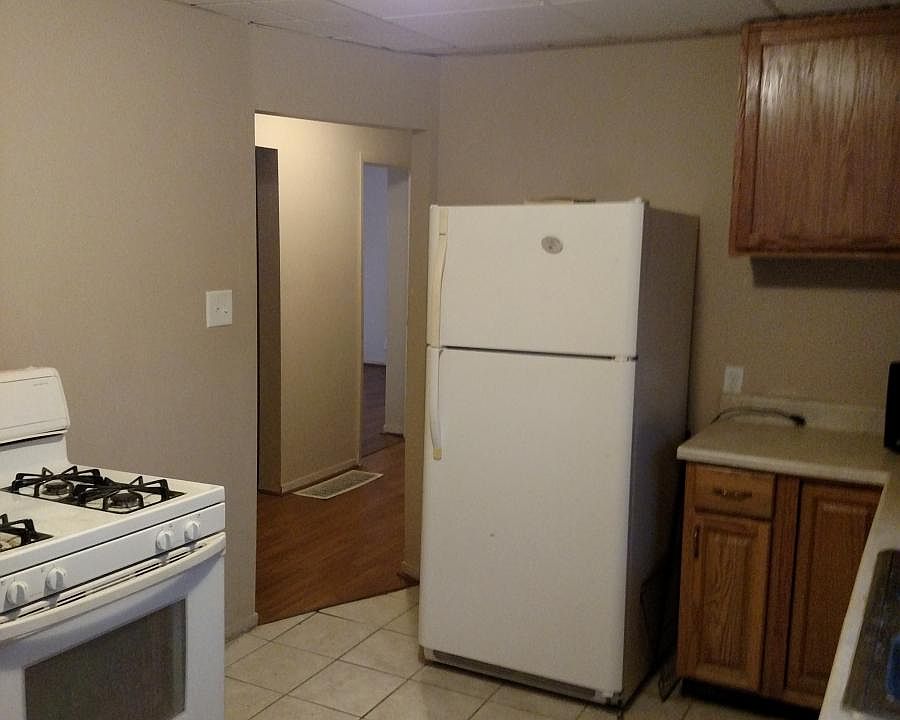 Kitchen includes stove and refrigerator
