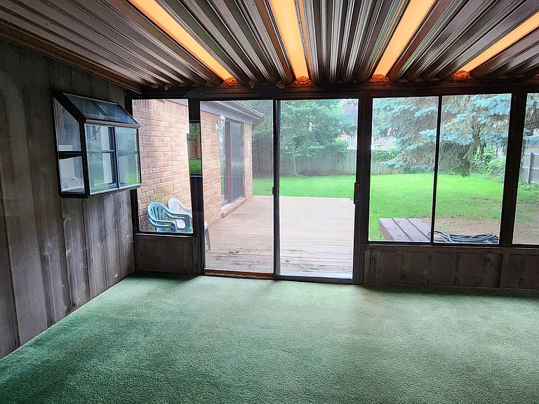 Florida Room looking into fenced back yard.