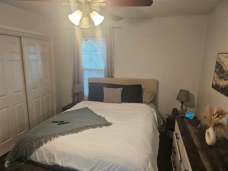 Bedroom with a closet and ceiling fan