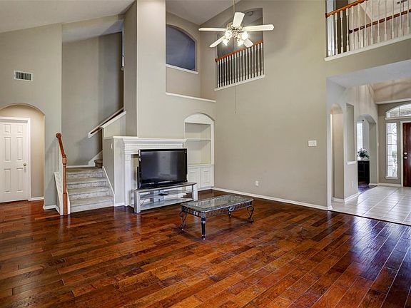 The large den makes furniture placement effortless. High-ceilings welcome even more natural light! Built-ins and fireplace add the finishing touch.