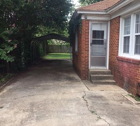 Car port along side of house