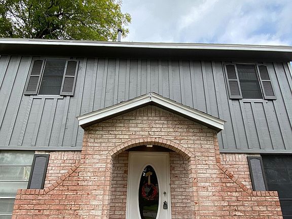 Newly Painted Front Door: New White Six Panel Doors Installed Throughout Home.