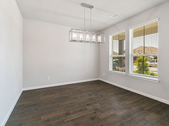 Dining room in the Ryder home plan by Trophy Signature Homes - REPRESENTATIVE PHOTO