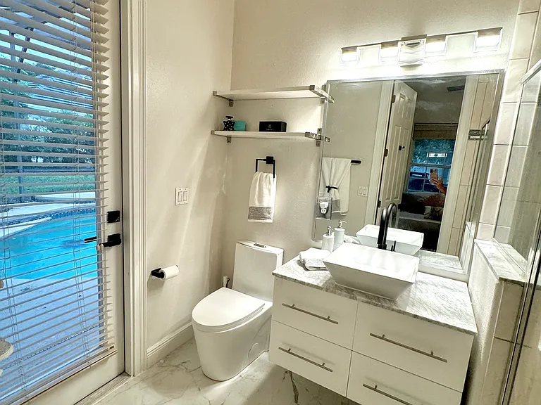 Bedroom #3 full bathroom (pool and side street access)