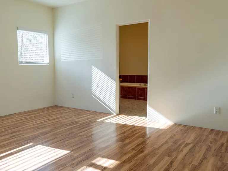 Primary bedroom, entrance to bathroom.